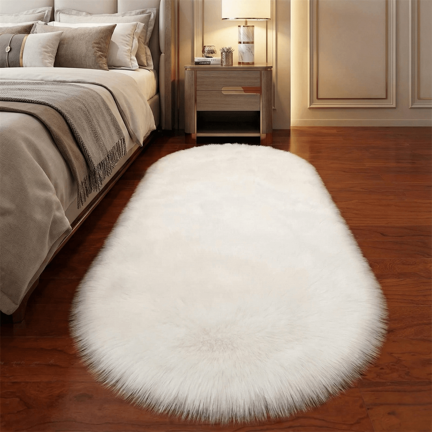 White fluffy rug on a wooden floor in a bedroom setting.